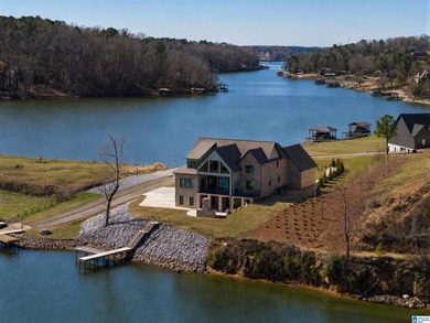 CUSTOM-BUILT NEW home with 165' of PRIVATE LAKEFRONT and - photo 2