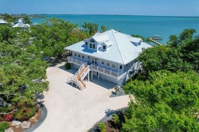 Welcome to 19 Grouper Hole Drive, a captivating waterfront - photo 2