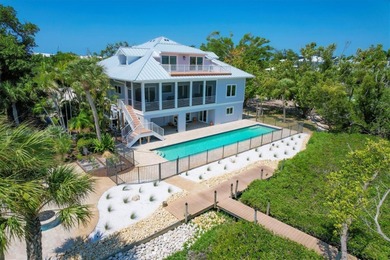 Welcome to 19 Grouper Hole Drive, a captivating waterfront - photo 3