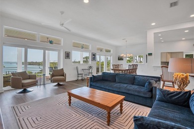 Welcome to 19 Grouper Hole Drive, a captivating waterfront - photo 6