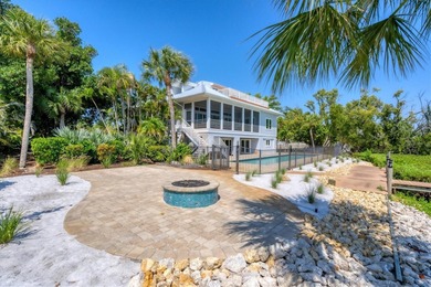 Welcome to 19 Grouper Hole Drive, a captivating waterfront - photo 36