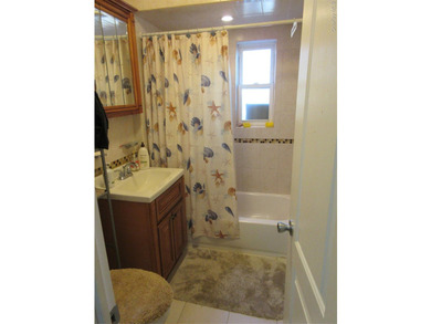 Well-maintained attached brick single- family home located in - photo 7
