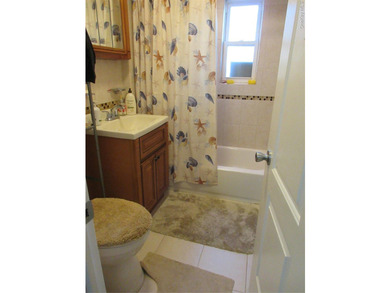 Well-maintained attached brick single- family home located in - photo 8