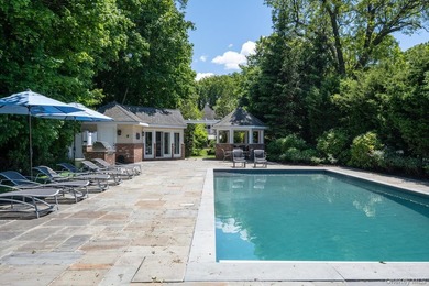 Welcome to 7 Cedar Lane, a remarkable turnkey residence perched - photo 16