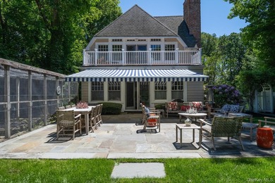 Welcome to 7 Cedar Lane, a remarkable turnkey residence perched - photo 19