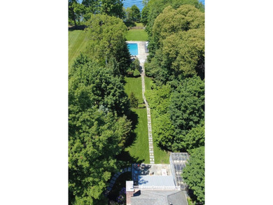 Welcome to 7 Cedar Lane, a remarkable turnkey residence perched - photo 25