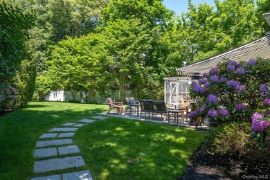 Welcome to 7 Cedar Lane, a remarkable turnkey residence perched - photo 27
