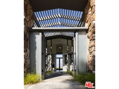 Tucked in an exclusive pocket of the Hollywood Hills, this - photo 1