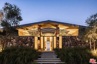Tucked in an exclusive pocket of the Hollywood Hills, this - photo 2