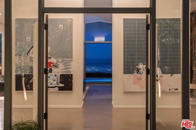 Tucked in an exclusive pocket of the Hollywood Hills, this - photo 4