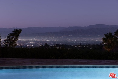 Tucked in an exclusive pocket of the Hollywood Hills, this - photo 5