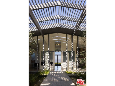 Tucked in an exclusive pocket of the Hollywood Hills, this - photo 6