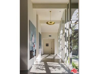 Tucked in an exclusive pocket of the Hollywood Hills, this - photo 8