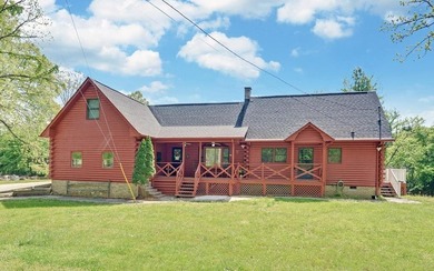 Wake up where the river is the main event. This true log cabin - photo 2