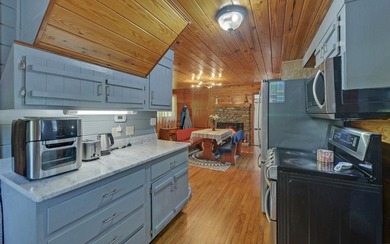 Wake up where the river is the main event. This true log cabin - photo 6