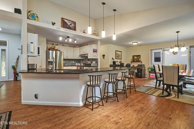 Step inside to an open floor plan featuring a spacious living - photo 10