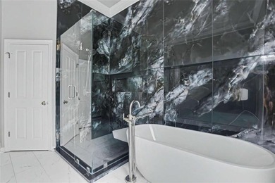 Experience elevated living in this exquisitely updated endunit - photo 13
