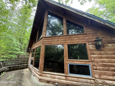 Tucked away on a private wooded setting just minutes from Lake - photo 13
