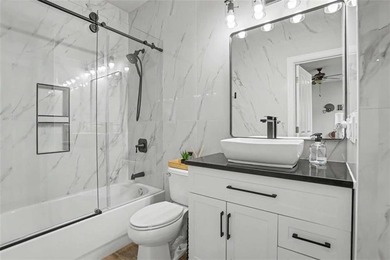 Experience elevated living in this exquisitely updated endunit - photo 16