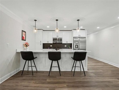 Experience elevated living in this exquisitely updated endunit - photo 20