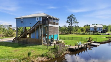 Waterfront living meets coastal charm in this beautifully - photo 1