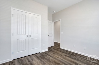 The Cypress floorplan by Smith Family Homes is under - photo 4