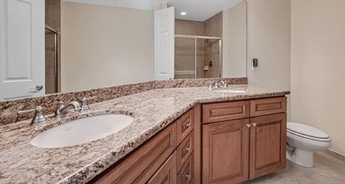 This lake front coach home has a brand-new roof, new AC with - photo 27