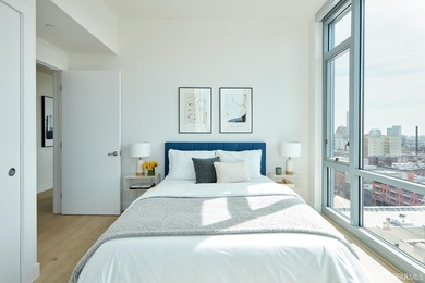 Situated on the 11th floor, this luminous two-bedroom, two-bath - photo 15