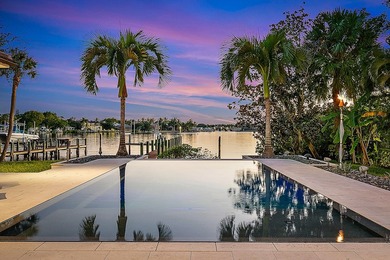 Nestled on nearly one acre of pristine riverfront, this - photo 3