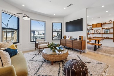 Thoughtfully renovated in 2023, this exceptional bi-level upper - photo 12