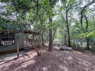 Tucked among the tall trees on beautiful Lake Franklin in the - photo 16