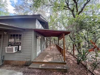 Tucked among the tall trees on beautiful Lake Franklin in the - photo 17