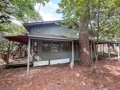 Tucked among the tall trees on beautiful Lake Franklin in the - photo 19