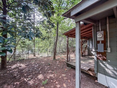 Tucked among the tall trees on beautiful Lake Franklin in the - photo 20