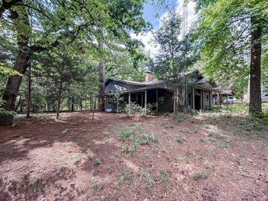 Tucked among the tall trees on beautiful Lake Franklin in the - photo 22