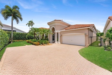 Nestled within the prestigious Woodfield Country Club, this - photo 2