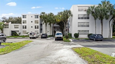 Located in the desirable Pine Island Ridge / Live Oak community