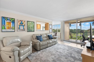 Located in the desirable Pine Island Ridge / Live Oak community