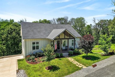 This waterfront lake home showcases an open floorplan and - photo 1