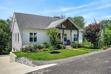 This waterfront lake home showcases an open floorplan and - photo 2