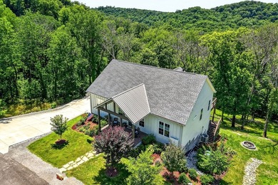 This waterfront lake home showcases an open floorplan and - photo 4