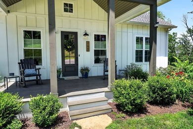 This waterfront lake home showcases an open floorplan and - photo 5