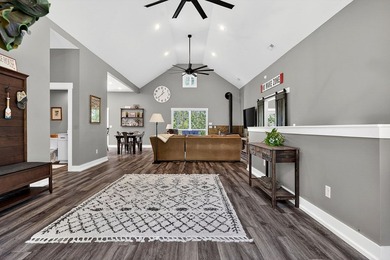 This waterfront lake home showcases an open floorplan and - photo 9