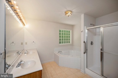 Nestled among mature green trees in the gated Lake of the Woods - photo 22