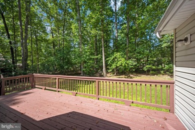 Nestled among mature green trees in the gated Lake of the Woods - photo 33