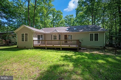 Nestled among mature green trees in the gated Lake of the Woods - photo 34