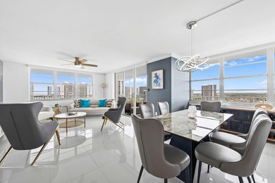 Stunning top-floor corner unit offering breathtaking wraparound - photo 2
