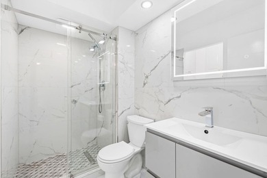 Stunning top-floor corner unit offering breathtaking wraparound - photo 9