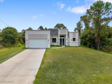 Lake Home For Sale in Lehigh Acres, Florida