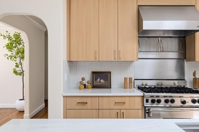 Situated on a picturesque tree-lined street and located down a - photo 11